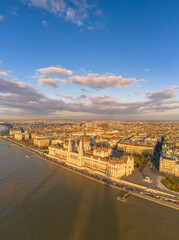 Aerial drone view of Hungarian Parliament by Danube river in Budapest sunset hour
