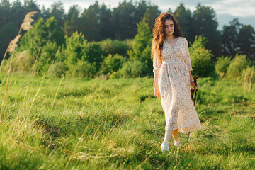 The brunette girl with a violin outdoor