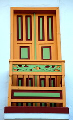 Wood carving art and color on a window