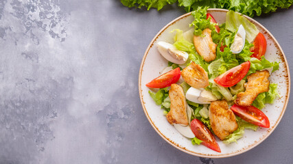 Chicken breast and vegetables salad. Top view, text space
