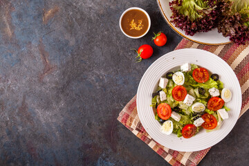 Top view of fresh vegetables salad on a plate. Healthy food concept. Text space