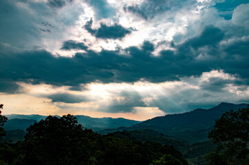 The sun shines through the clouds after rain