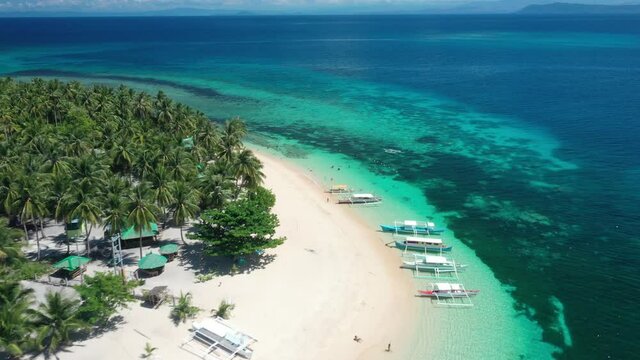 Aerial View of Majestic White Sand Beach, Tropical Sea and Lush Vegetation on Corregidor Island, Luzon, Philippines