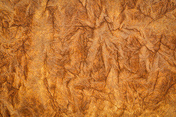 burnt sienna - background and texture of backlit handmade Nepalese momi lokta paper