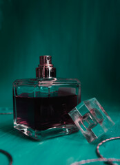 perfume bottle on green background