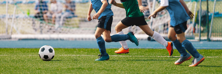 Group of Kids Soccer Players on  Speed Run To Shoot the Ball. Children Football Teams Kicking...