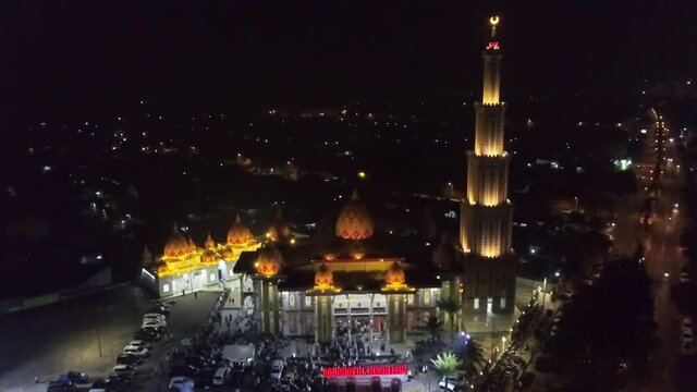 shooting a large and luxurious mosque in the city of Jember at night using a drone camera, really beautiful and enchanting.