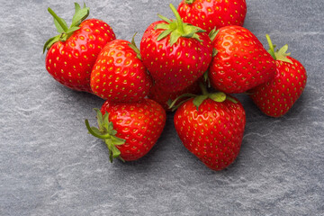 Strawberries on a gray granite table. Selective focus