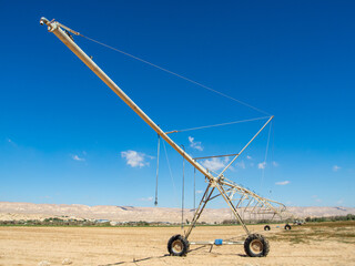 Center-pivot irrigation also called water-wheel and circle irrigation, is a method of crop irrigation in which equipment rotates around a pivot and crops are watered with sprinklers.