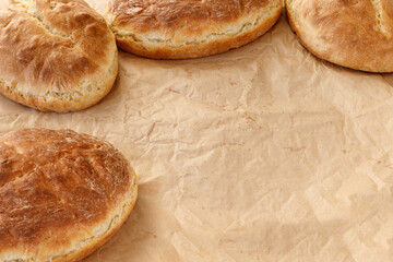 Fresh homemade wheat bread on  wooden table.