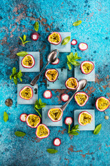 top view of fresh ripe delicious passion fruits with mint leaves