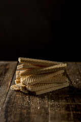 Heap of wafers on an old wooden table
