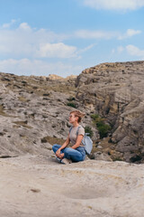Young beautiful women on a camping trip, 
 young woman hiking, woman hiking on a background of mountains