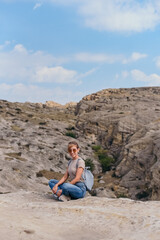 Fototapeta premium Young beautiful women on a camping trip, young woman hiking, woman hiking on a background of mountains