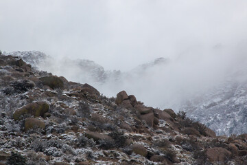 Winter mountain with snow and a morning cloud