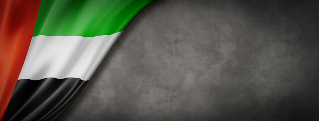 United Arab Emirates flag on concrete wall banner
