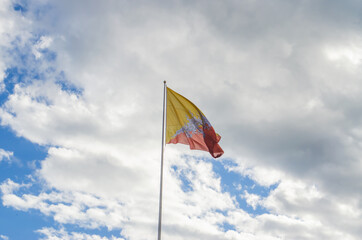  Bhutanese National flag fluttering  in front of Thimphu Dzong featuring the Thunder dragon