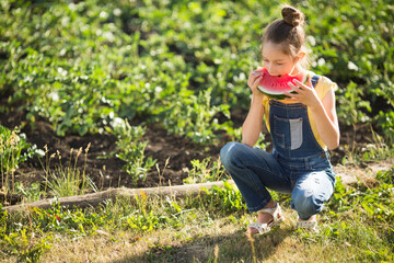 beautiful young teenage girl eating watermelon