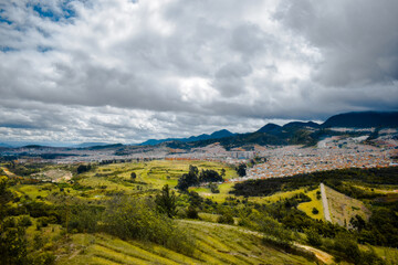 panoramic view of the valley in the mountains and in the background the city