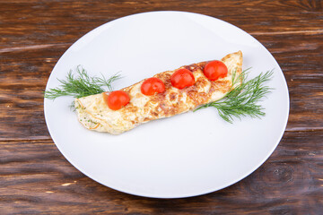 Omelet with cheese and tomatoes
