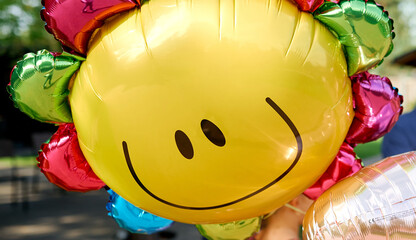 Yellow balloon with smile look like sunny 
