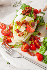 romaine lettuce topped with bacon tomato parmesan, sauce. healthy keto paleo diet lunch