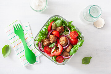 keto paleo lunch box with meatballs, lettuce, tomato, cucumber, bell pepper