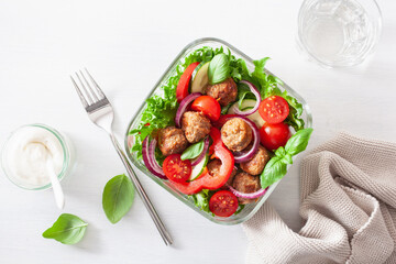 keto paleo lunch box with meatballs, lettuce, tomato, cucumber, bell pepper