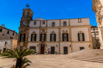 A clock tower in Martina Franca, Puglia, Italy in the summertime