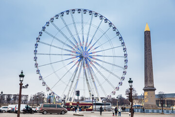 Wheel of Paris and Luxor Obelisk at the Place de la Concorde in a cold winter day