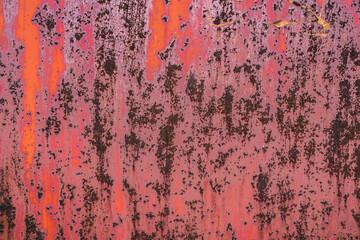 The old iron background is painted in red, pink, purple with rust and chips.