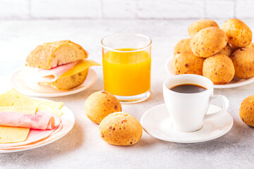 Traditional Brazilian breakfast - cheese bread, coffee, ripe fruit.