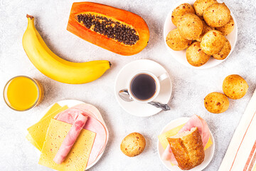Traditional Brazilian breakfast - cheese bread, coffee, ripe fruit.