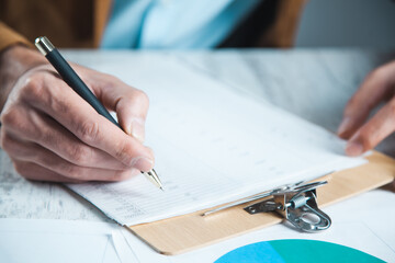 man hand pen and document