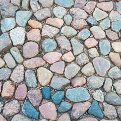 cobblestone pavement made of round stone around the ancient Peter and Paul Fortress in St. Petersburg, Russia