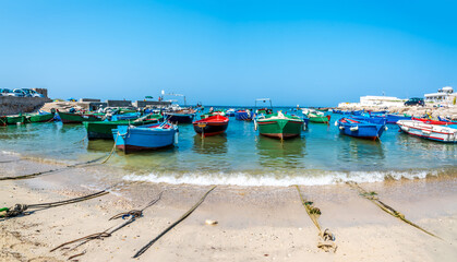 Fototapeta na wymiar Boats moored in the harbour at Cala San Vito, Puglia, Italy