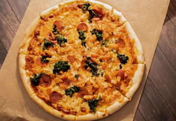 Pizza with tomato sauce, cheese, and spinach
