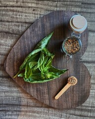 basil and spices on a wooden board