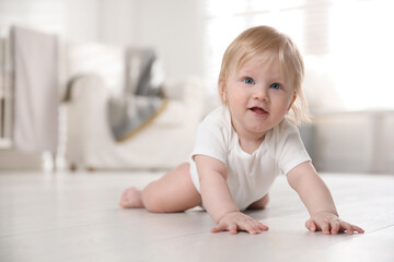 Fototapeta premium Cute little baby on floor at home