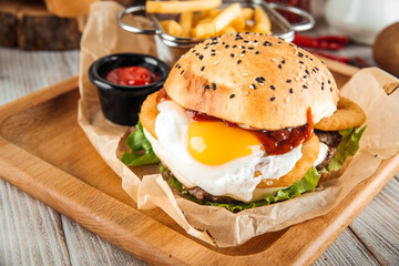 Closeup on appetizing burger with fried egg