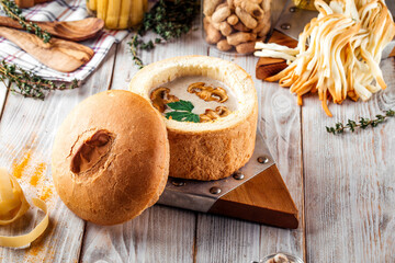 Gourmet mushroom cream soup in a bread bowl