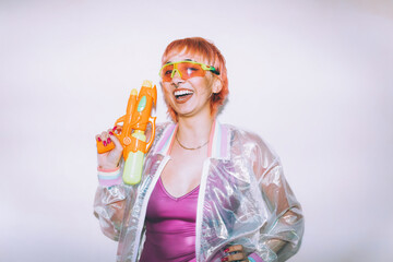 Retro futuristic woman pointing gun and looking at camera