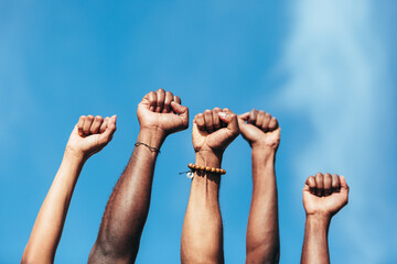 Fists of anonymous persons as a gesture against racism.