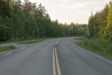 Empty road to Midsummer sunset sun