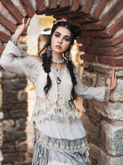 Beautiful women in the old city.Outdoor portrait of pretty brunette.Girl wearing stylish boho chic outfit.Outdoors fashion photo of beautiful bohemian lady. 