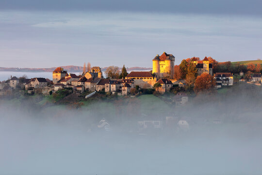 Curemonte labelled l'un des plus beaux villages de France (most beautiful villages in France) in the morning mist, Correze, Nouvelle-Aquitaine, France