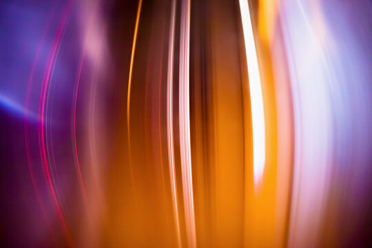 Full frame abstract image of orange light trails