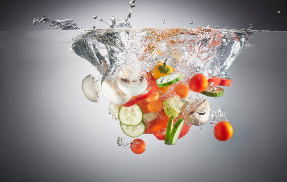 Close-up of chopped vegetables in splashing water