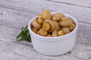 Pickled champignon heap in the bowl