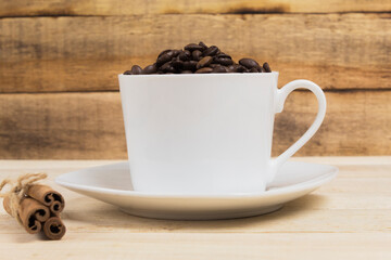 White cup with coffee grains